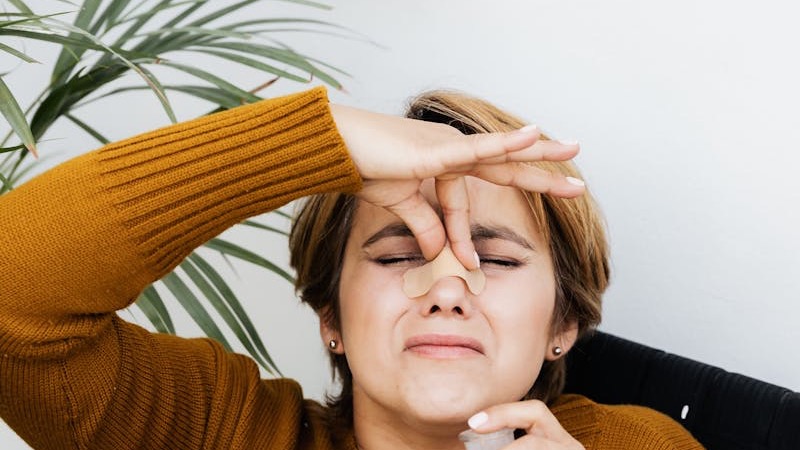 Technician performing AC deep cleaning and odor removal in Qatar