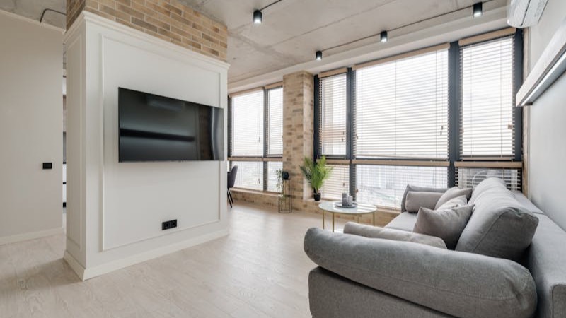 Technician repairing a wall-mounted split AC unit in Doha